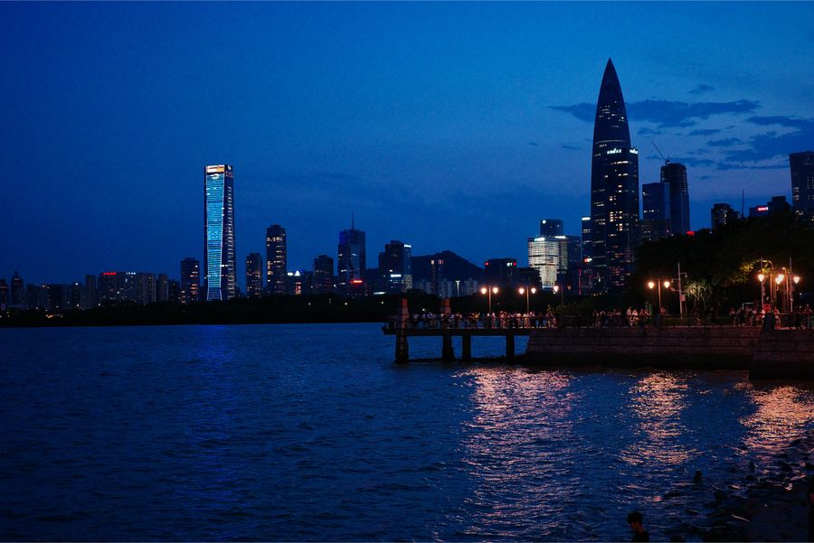 City skyline across the water at blue hour